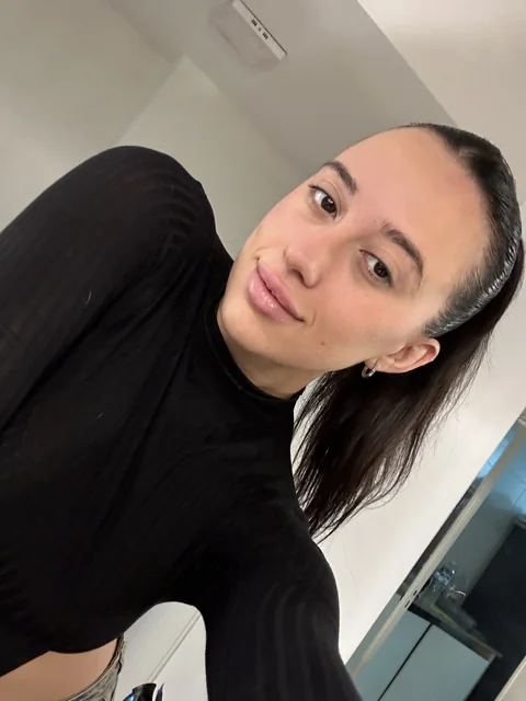 Natalye with her hair tied back